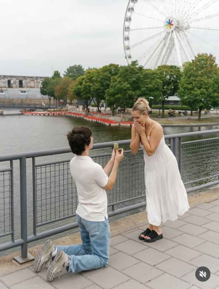 Image - Mandy's IPhone's boyfriend & now-fiancé, Martin, kneeling down with two feet as he proposed to her in August 2025. (Source: @thatmartinkid/Instagram).