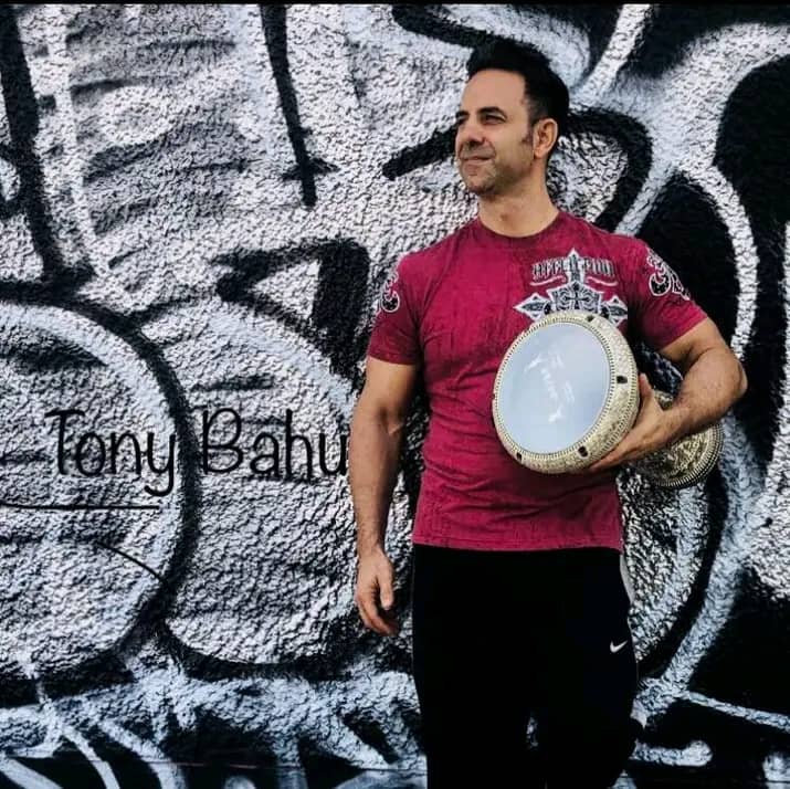 Image - Angelo Bahu’s dad, Tony Bahu, is pictured playing the drum from an art event at Wynwood Arts District, Miami, Florida, back in December 10, 2017. 