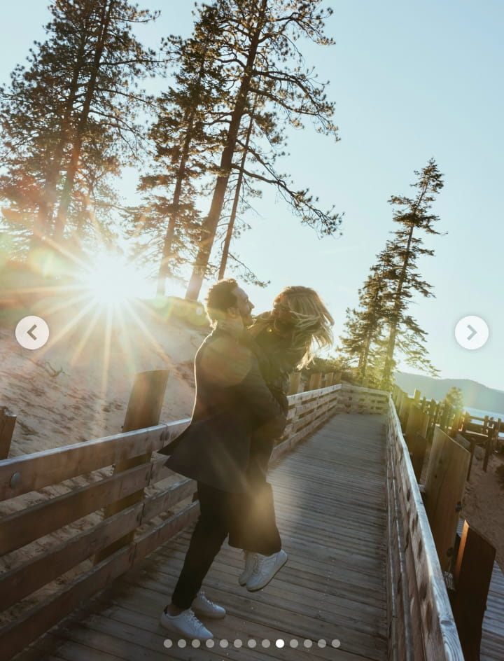 Image - Liv Swearingen, is pictured with her boyfriend, Jake McGrew, as he carries her up, in a chest-to-chest hug, following their engagement, back on April 14, 2026.